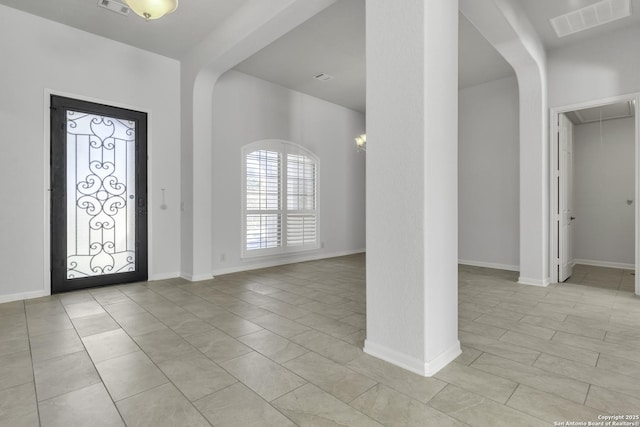 foyer entrance with beam ceiling