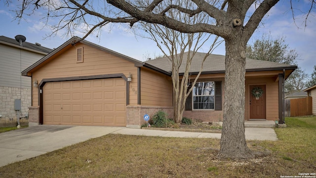 single story home featuring a garage and a front yard