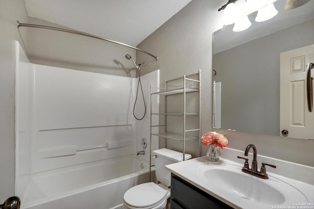 full bathroom with a textured ceiling, shower / bathing tub combination, vanity, and toilet