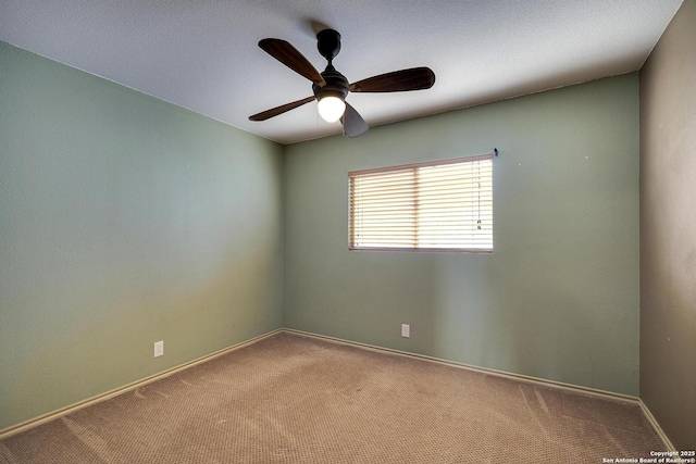 empty room with ceiling fan and carpet flooring