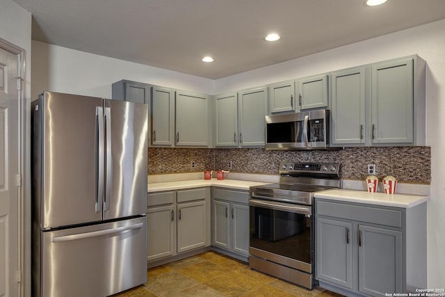 kitchen featuring decorative backsplash and appliances with stainless steel finishes