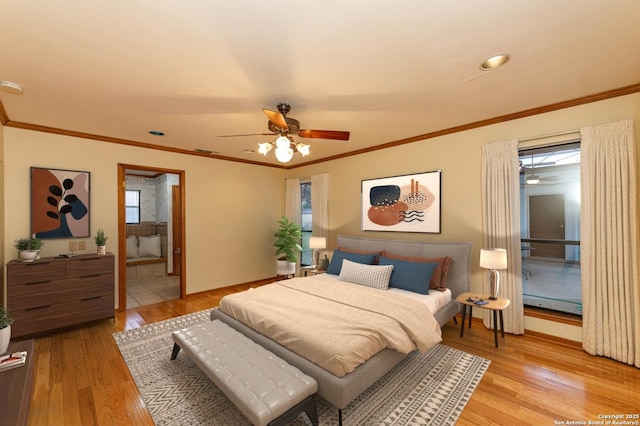 bedroom with crown molding, light hardwood / wood-style flooring, ensuite bath, and ceiling fan