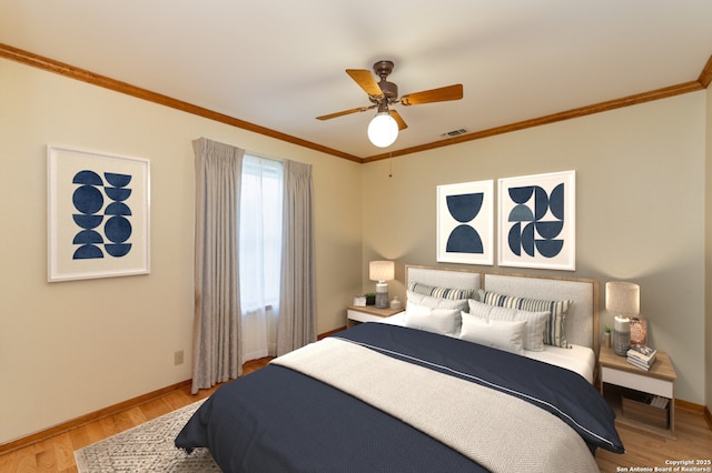 bedroom featuring light wood-type flooring, ceiling fan, and ornamental molding