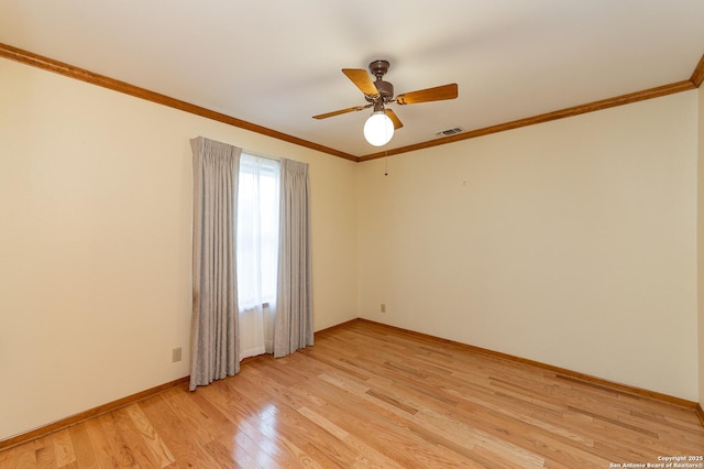 unfurnished room featuring ceiling fan, ornamental molding, and light hardwood / wood-style floors