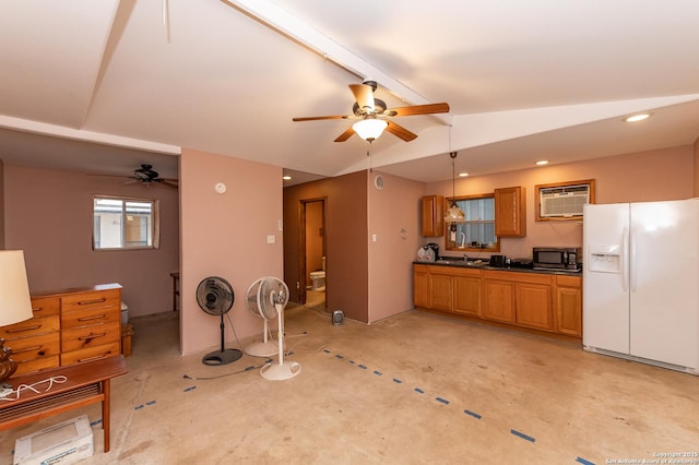 kitchen with white fridge with ice dispenser, ceiling fan, vaulted ceiling, and a wall unit AC