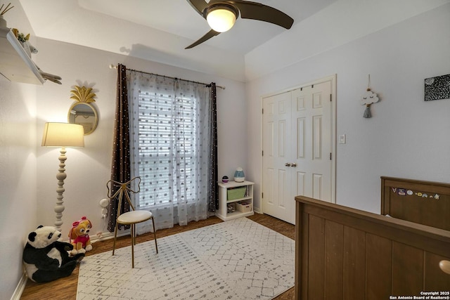 bedroom with ceiling fan, hardwood / wood-style floors, and a closet