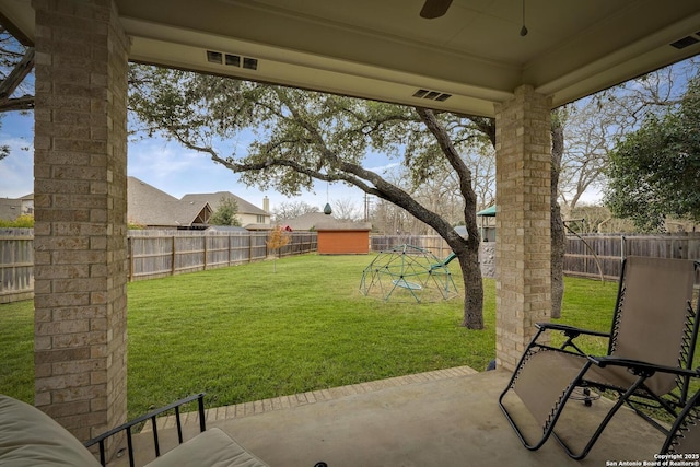 view of yard with a playground and a patio area