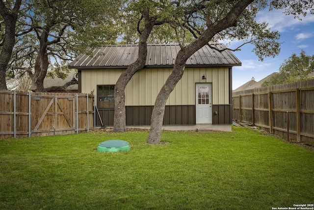 view of outdoor structure featuring a lawn