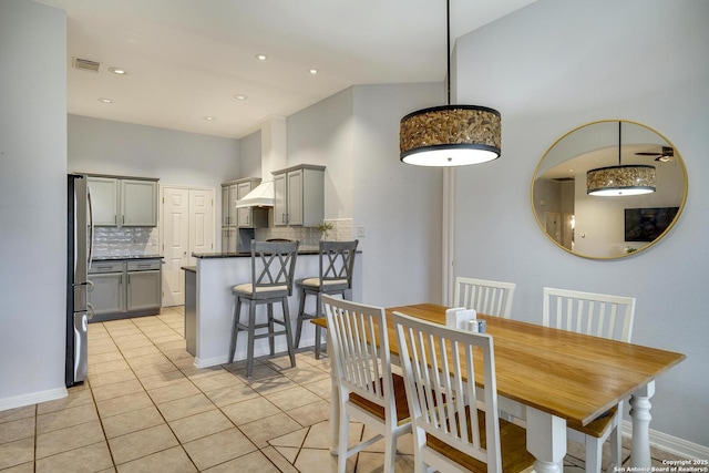 dining space featuring light tile patterned floors