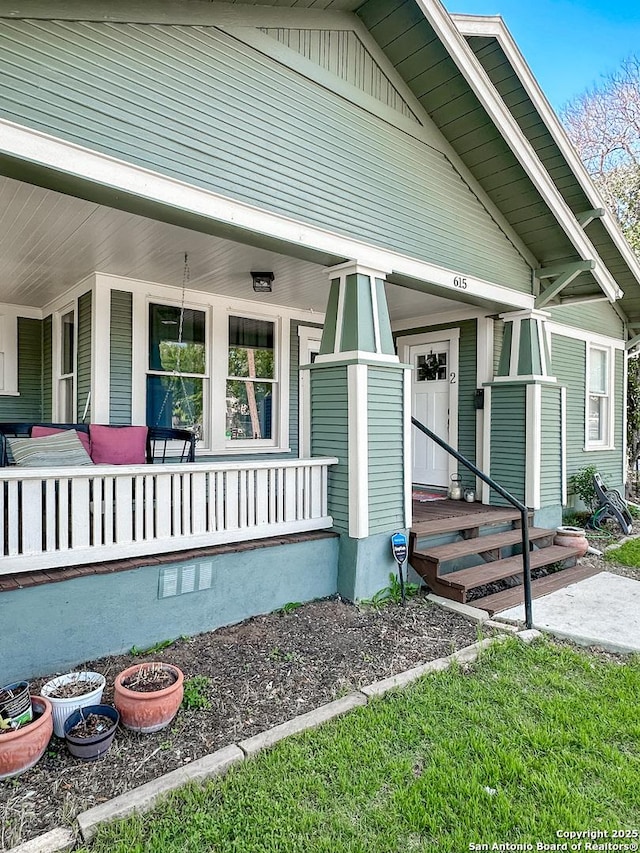 doorway to property featuring a porch