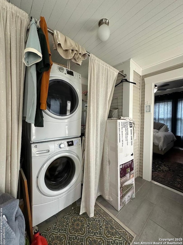 washroom with stacked washer / dryer