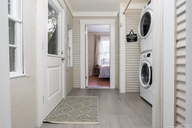 washroom with stacked washer and dryer