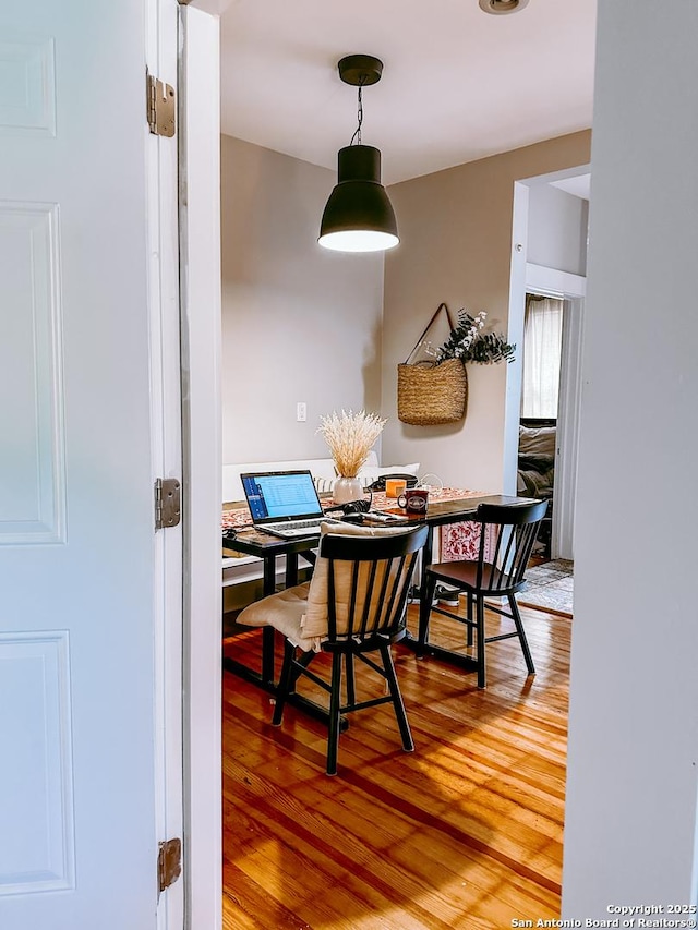 dining area with hardwood / wood-style floors