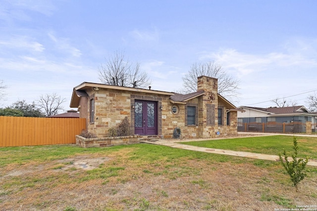 view of front of home featuring a front lawn and french doors