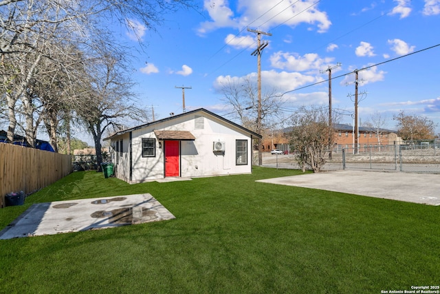 rear view of property with a patio area and a yard