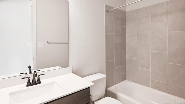 606 Inner Path, New Braunfels, TX 78132 - full bathroom with vanity, a textured wall, shower / bathtub combination, and toilet
