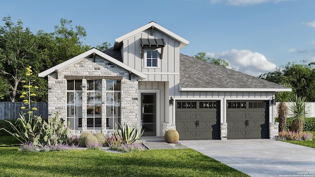 view of front of house with a garage and a front yard