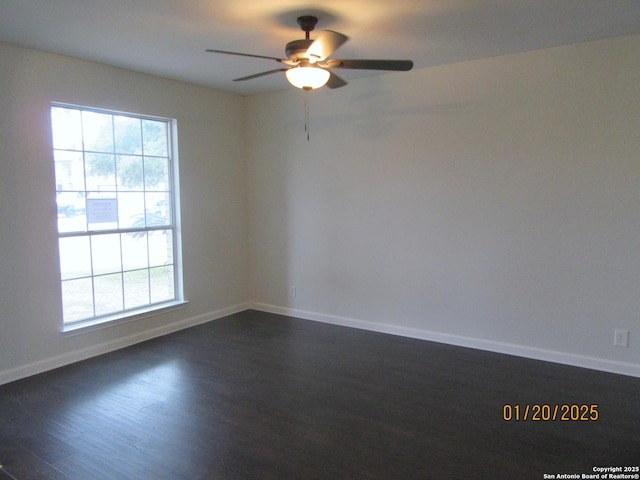 unfurnished room with ceiling fan, dark hardwood / wood-style floors, and a healthy amount of sunlight