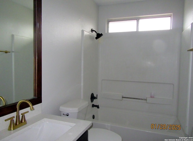 full bathroom featuring toilet, vanity, and  shower combination