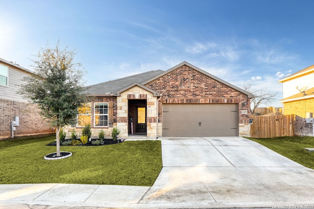 view of front of house with a front yard and a garage