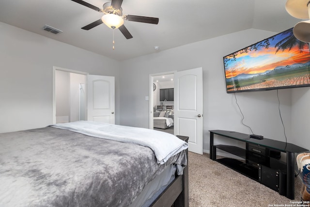 carpeted bedroom with lofted ceiling, ensuite bath, and ceiling fan