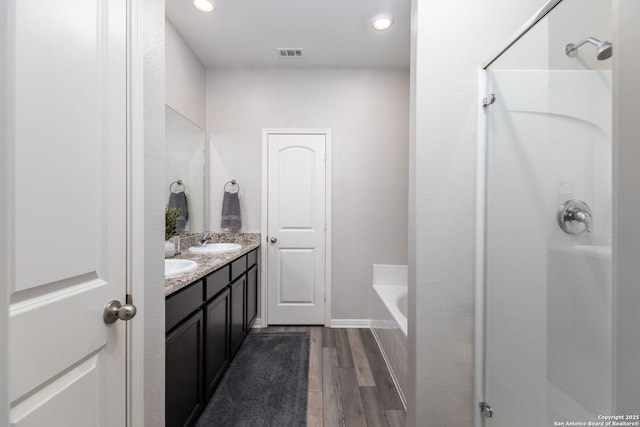 bathroom featuring vanity and a bathtub