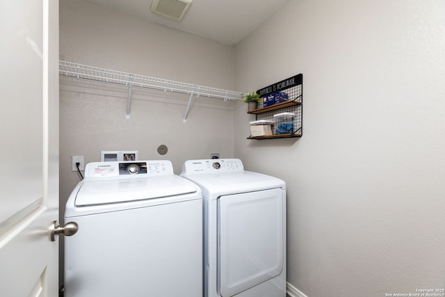 laundry area with washer and dryer