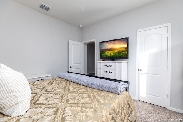 bedroom featuring light colored carpet