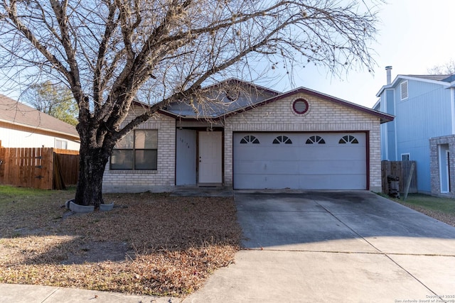 ranch-style house featuring a garage