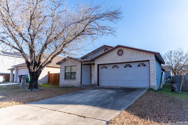 ranch-style house featuring a garage