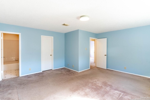 unfurnished room featuring carpet floors