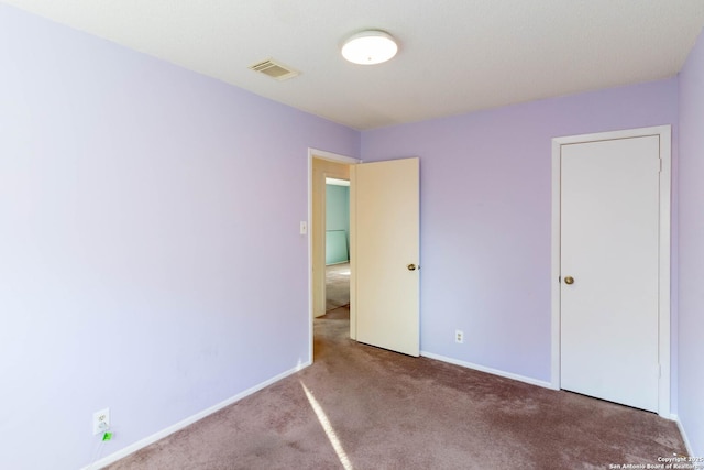 unfurnished bedroom with carpet