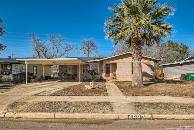 view of front of home with a carport and solar panels