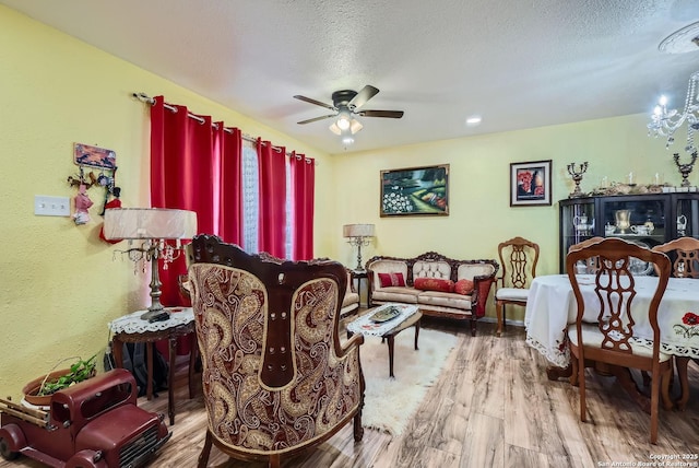 4623 Bernadine Dr, San Antonio, TX 78220 - living area featuring ceiling fan, hardwood / wood-style flooring, and a textured ceiling