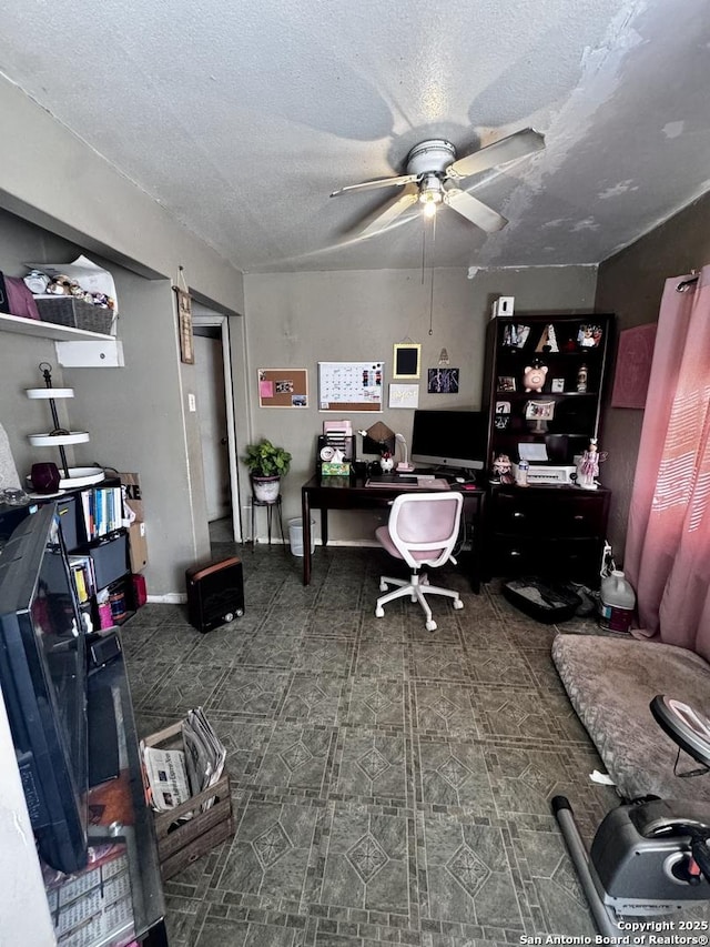 office featuring ceiling fan and a textured ceiling