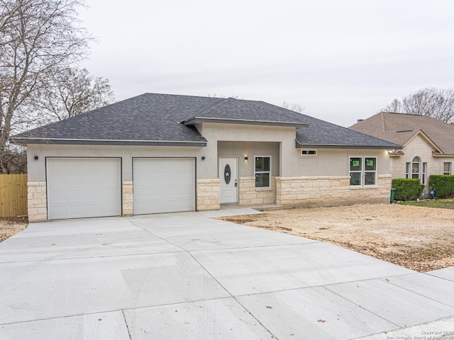 prairie-style house featuring a garage