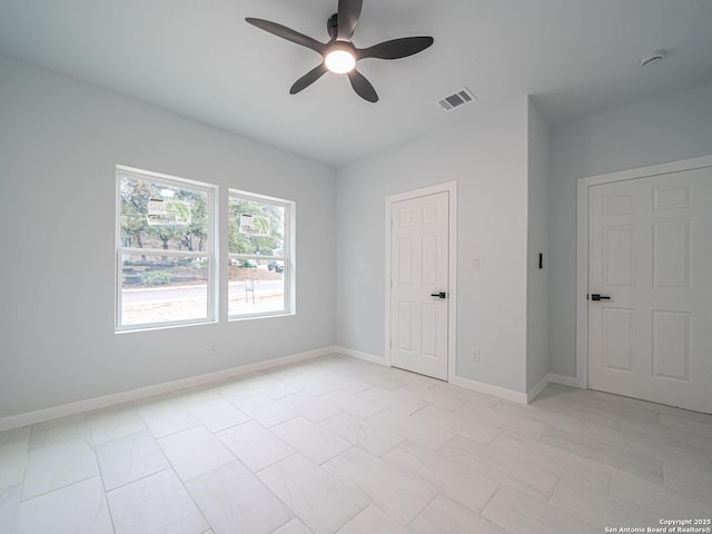 unfurnished room featuring ceiling fan