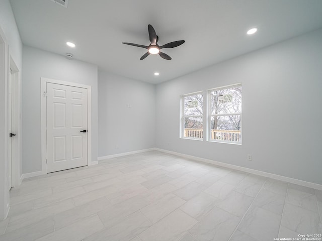 empty room featuring ceiling fan