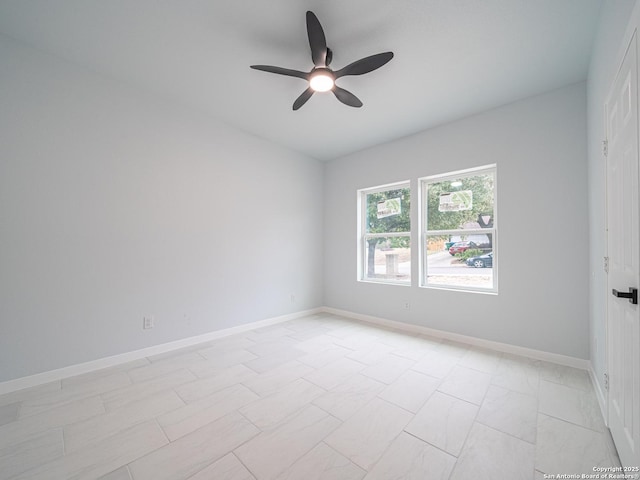 empty room featuring ceiling fan