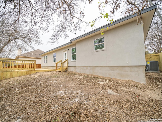 rear view of house with cooling unit