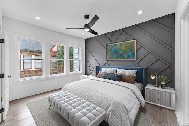 bedroom featuring ceiling fan and hardwood / wood-style floors