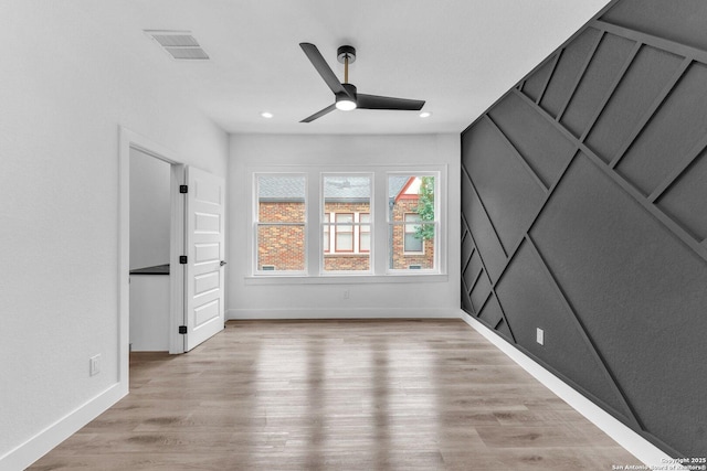 interior space with light hardwood / wood-style floors and ceiling fan