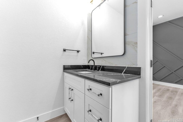 bathroom featuring vanity and wood-type flooring