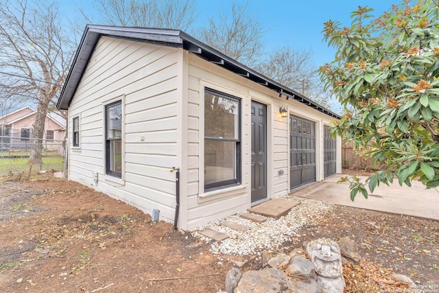 view of property exterior with a patio area