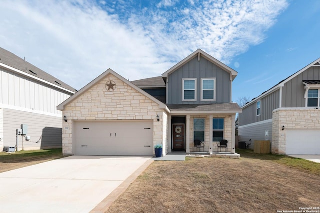 craftsman inspired home with a garage and a front lawn