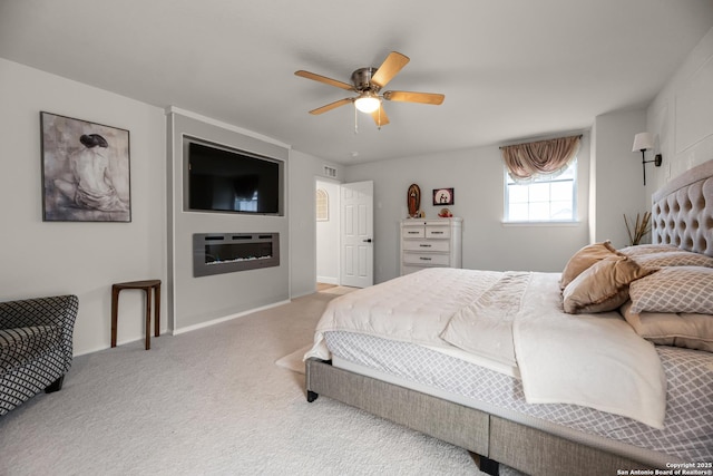 bedroom featuring light carpet and ceiling fan