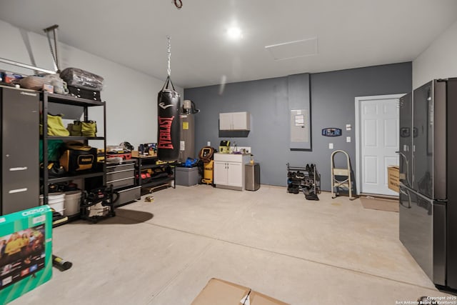 garage with black refrigerator and water heater