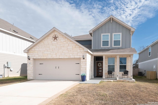 craftsman-style house with covered porch, cooling unit, a garage, and a front lawn