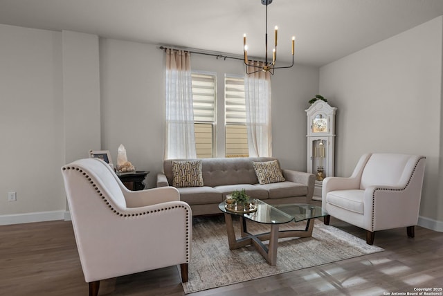 living room featuring dark wood-type flooring and a chandelier