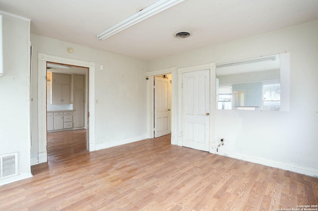 empty room with light wood-type flooring